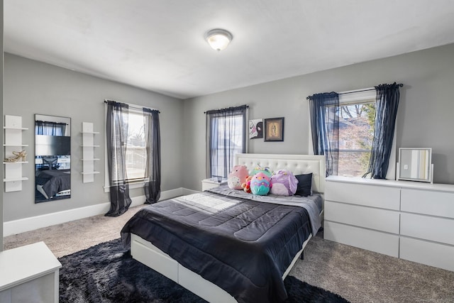 bedroom with carpet flooring and multiple windows