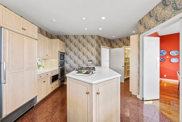 kitchen with dark hardwood / wood-style flooring, built in appliances, and a kitchen island