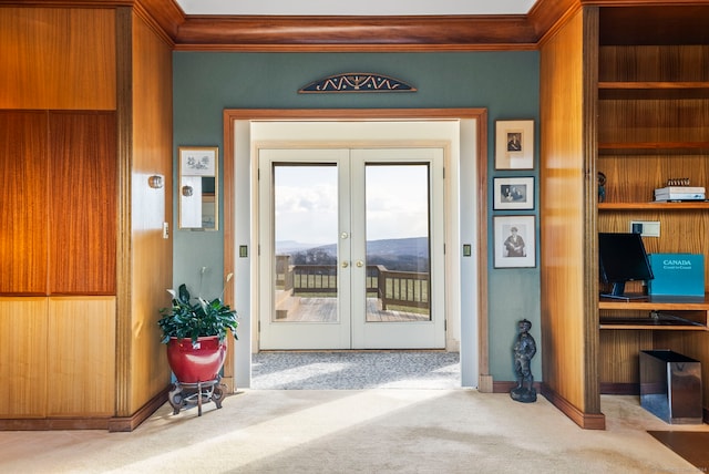 doorway with light colored carpet and french doors