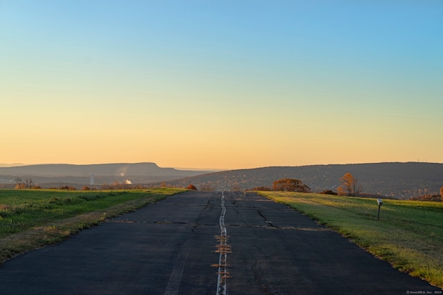 view of street featuring a mountain view and a rural view