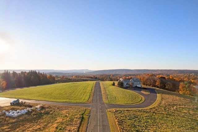 birds eye view of property with a rural view