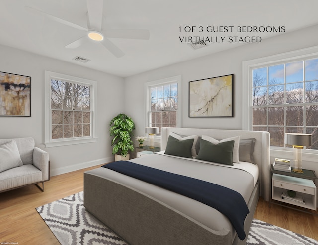 bedroom featuring multiple windows, wood-type flooring, and ceiling fan