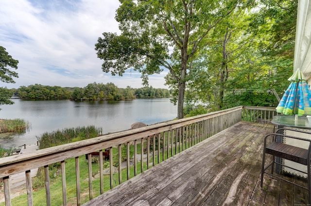 wooden deck featuring a water view