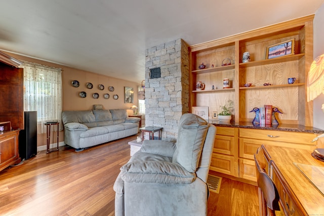 living room with light hardwood / wood-style flooring