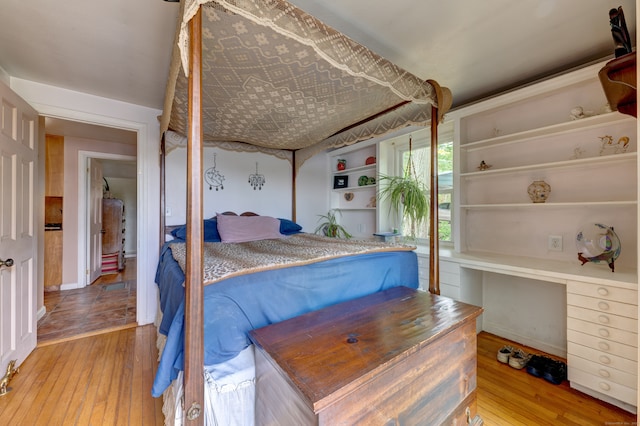 bedroom with hardwood / wood-style flooring