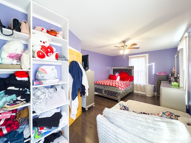 bedroom featuring ceiling fan and dark hardwood / wood-style flooring