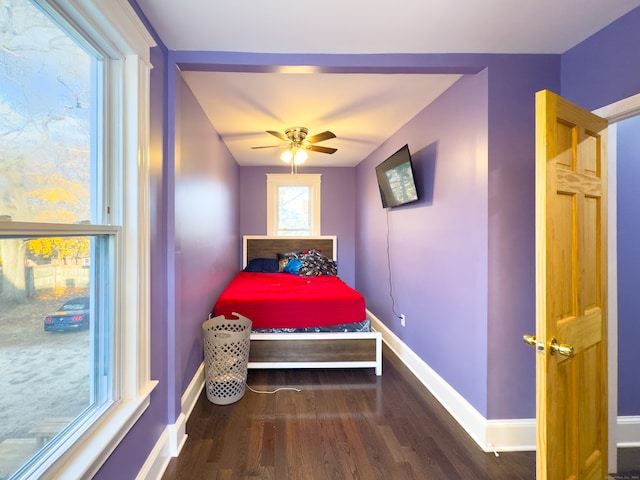 bedroom featuring hardwood / wood-style floors and ceiling fan