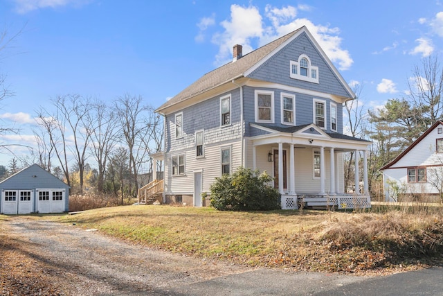 view of front of home with a porch and an outbuilding