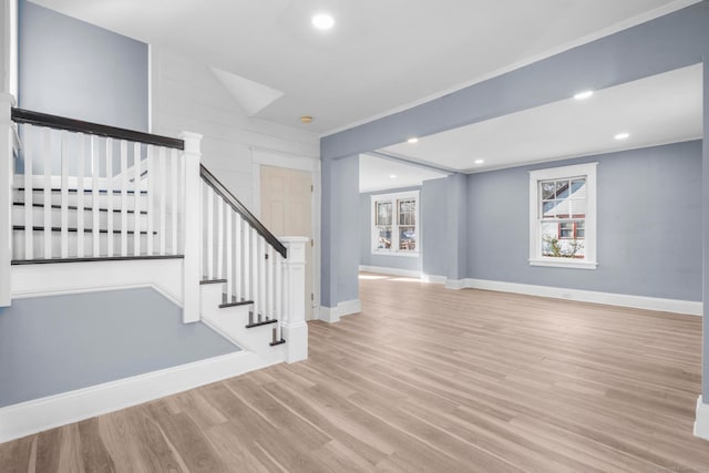 interior space featuring light hardwood / wood-style flooring and ornamental molding