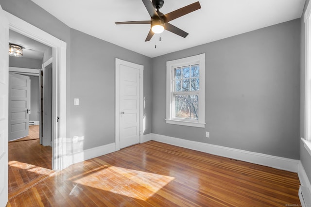 unfurnished bedroom featuring ceiling fan and wood-type flooring