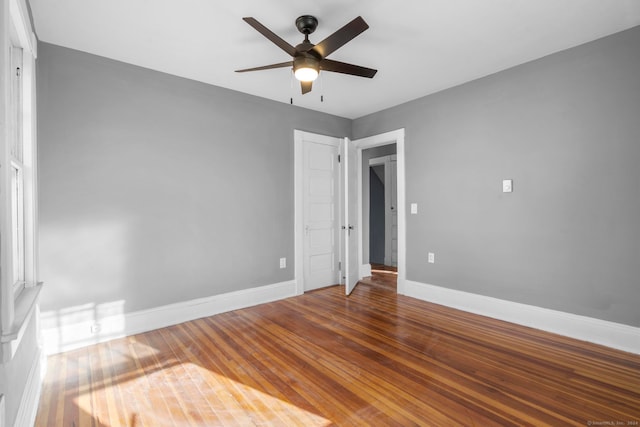 unfurnished bedroom featuring ceiling fan and hardwood / wood-style flooring