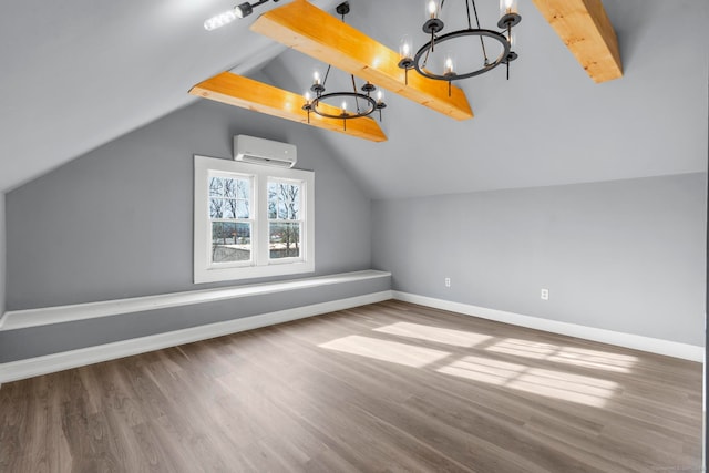 additional living space featuring hardwood / wood-style floors, vaulted ceiling with beams, a wall unit AC, and a notable chandelier