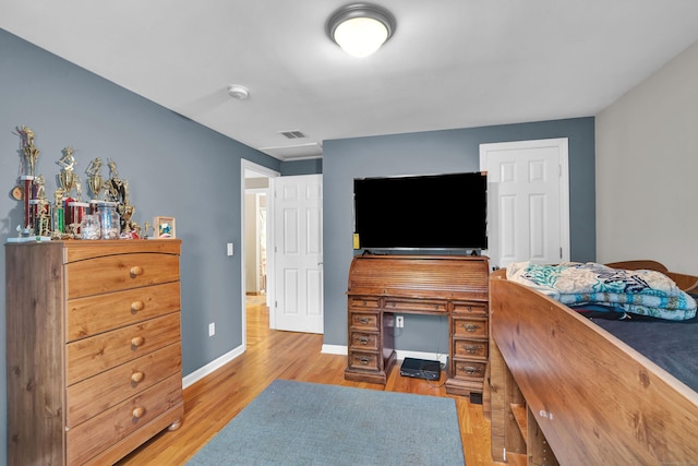 bedroom with light wood-type flooring