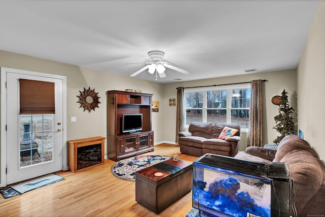 living room with ceiling fan and hardwood / wood-style floors