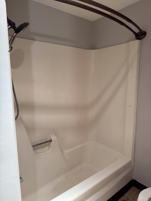 bathroom featuring tile patterned floors and toilet