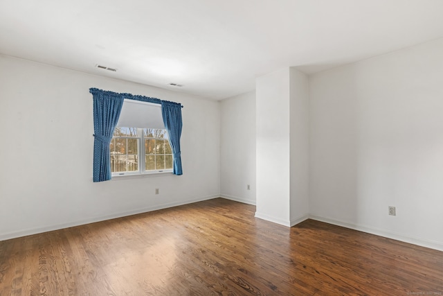 empty room featuring wood-type flooring