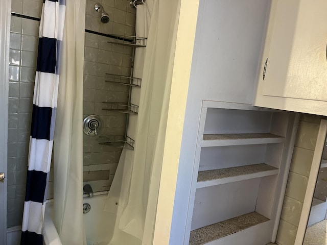 bathroom with shower / bath combination with curtain