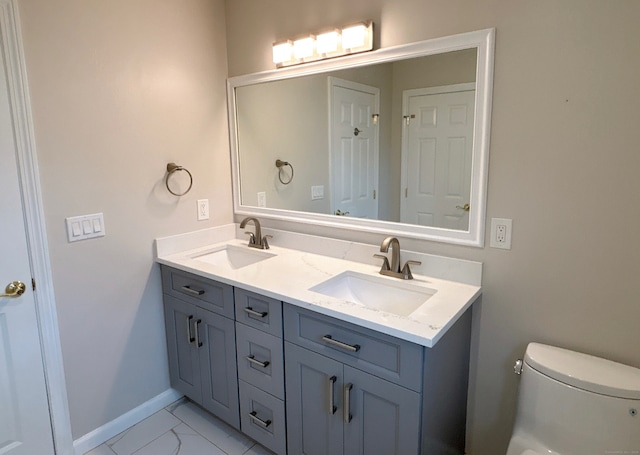 bathroom with vanity and toilet