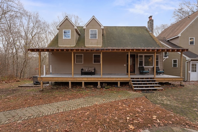 view of front facade with outdoor lounge area