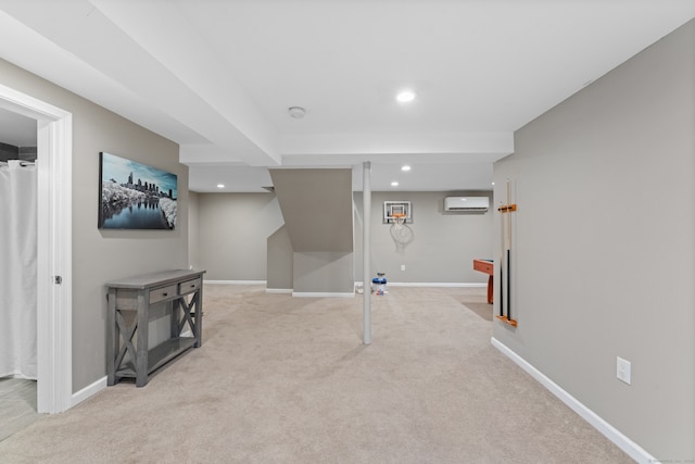 basement featuring a wall mounted AC and light carpet