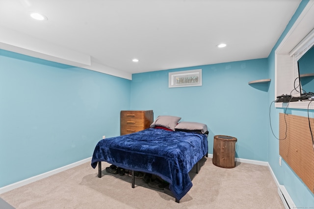 carpeted bedroom with a baseboard radiator