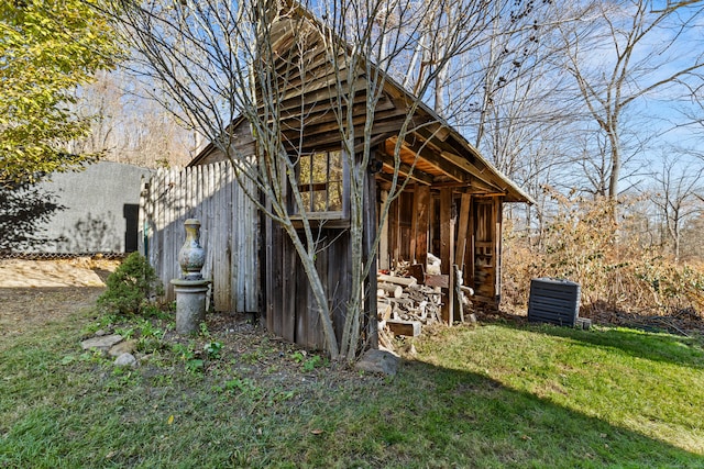 view of home's exterior featuring an outbuilding and a yard