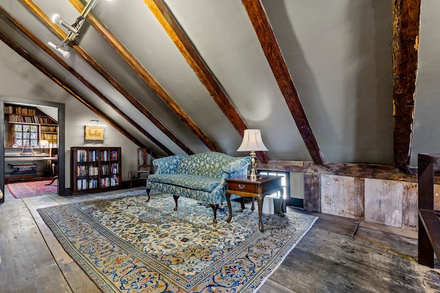 sitting room featuring hardwood / wood-style flooring and lofted ceiling with beams