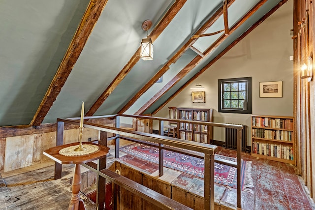 bonus room with vaulted ceiling with beams