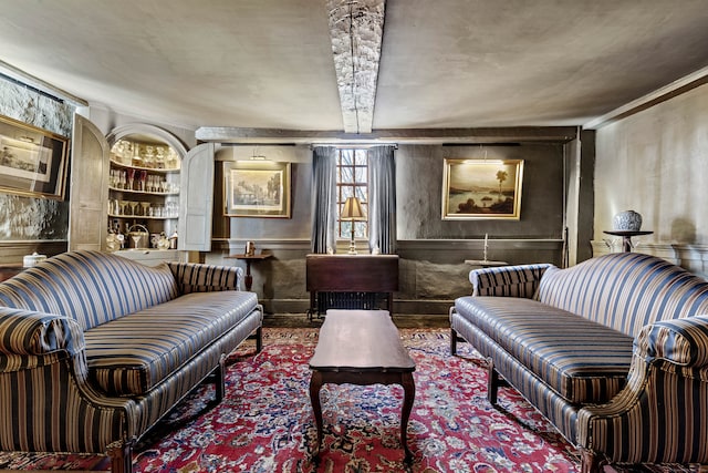 sitting room with beamed ceiling