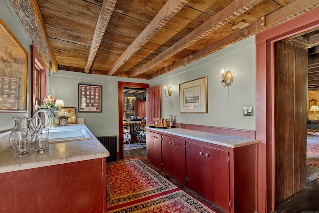 bathroom featuring vanity, beam ceiling, and wood ceiling