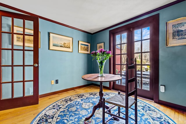 office space featuring french doors, ornamental molding, and wood-type flooring