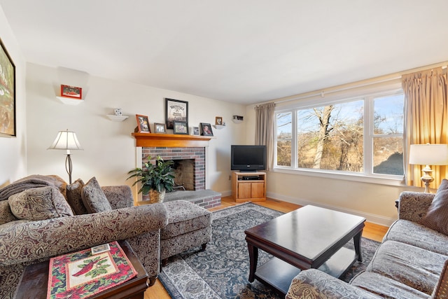 living room with a fireplace and hardwood / wood-style floors