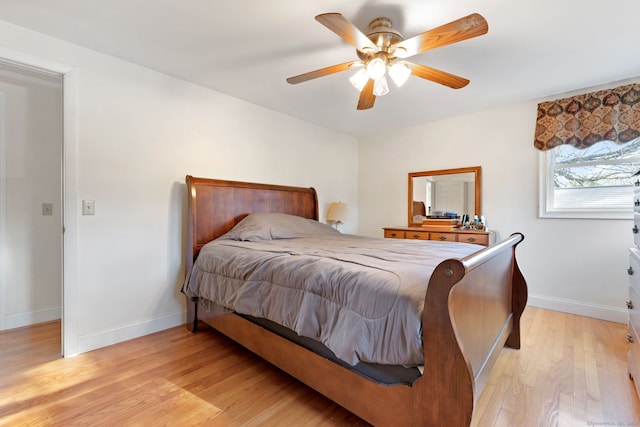 bedroom featuring light wood-type flooring and ceiling fan