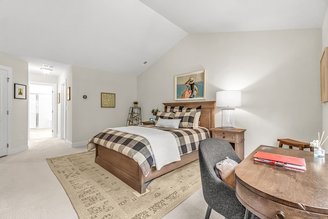 carpeted bedroom featuring lofted ceiling