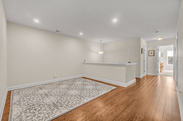 empty room with hardwood / wood-style flooring