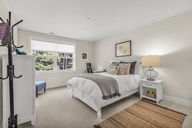 bedroom with light carpet