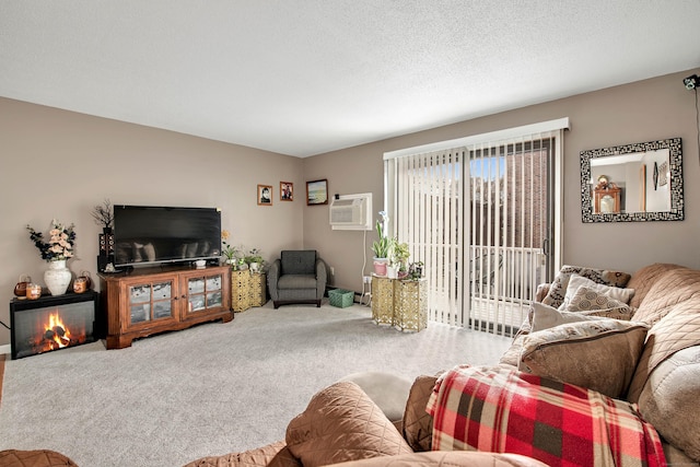 carpeted living room featuring an AC wall unit