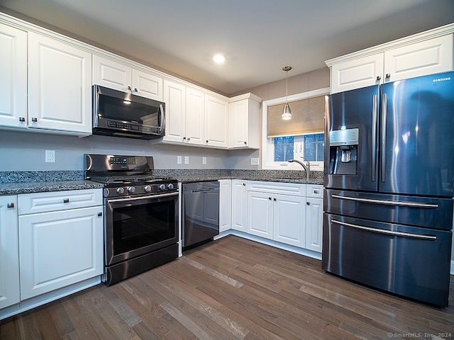 kitchen featuring sink, dark hardwood / wood-style floors, decorative light fixtures, white cabinetry, and stainless steel appliances