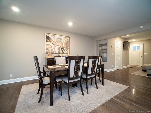 dining space featuring dark hardwood / wood-style flooring