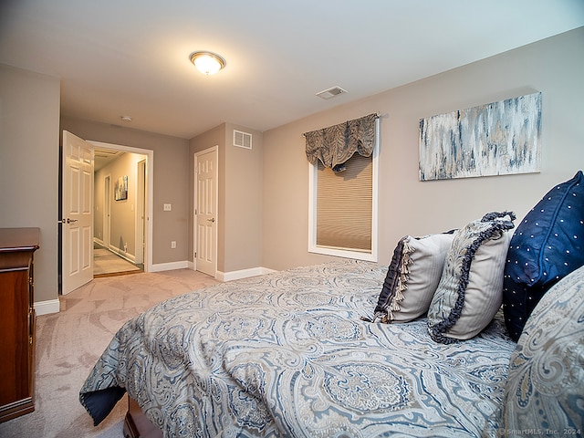 bedroom featuring light colored carpet