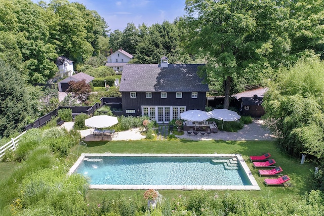 279 Black Rock Tpke, Redding, CT 06896 - back of property featuring french doors, a patio, an outdoor pool, and outdoor dining space
