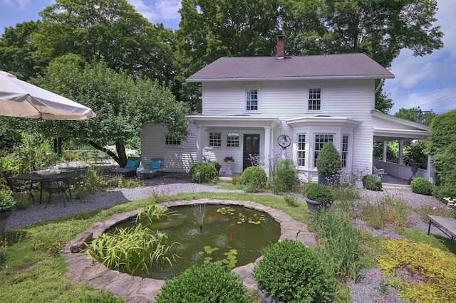 279 Black Rock Tpke, Redding, CT 06896 - view of front facade with a chimney and a garden pond