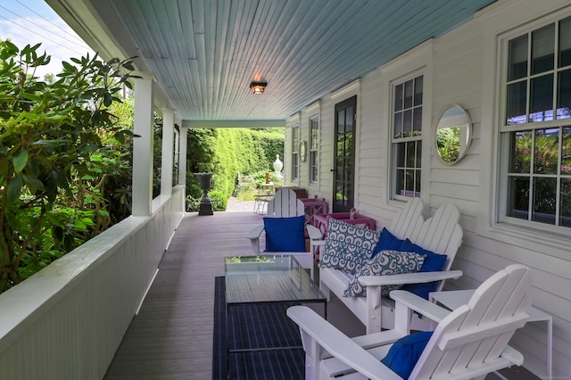 wooden terrace with a porch