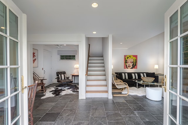 interior space featuring ceiling fan and french doors