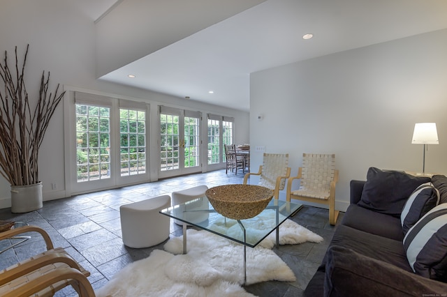 living room with a towering ceiling