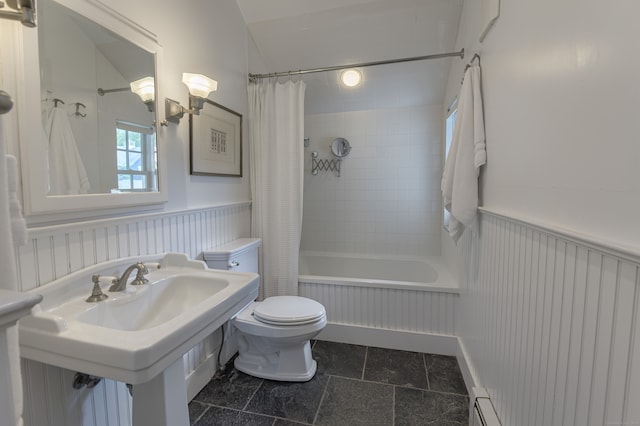 bathroom featuring tile patterned floors, toilet, and shower / bath combo with shower curtain