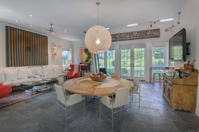 dining space with french doors and ceiling fan