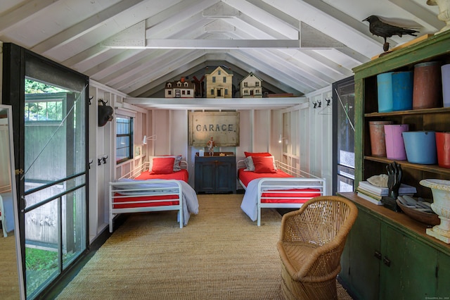 bedroom featuring light colored carpet and lofted ceiling with beams