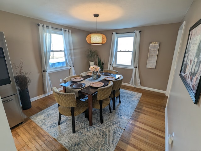 dining area featuring wood-type flooring