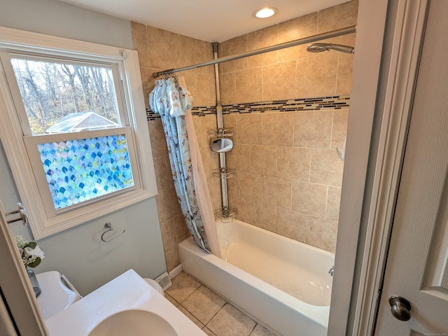 bathroom featuring tile patterned flooring and shower / tub combo